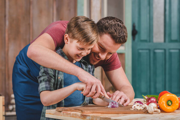 father with son preparing food