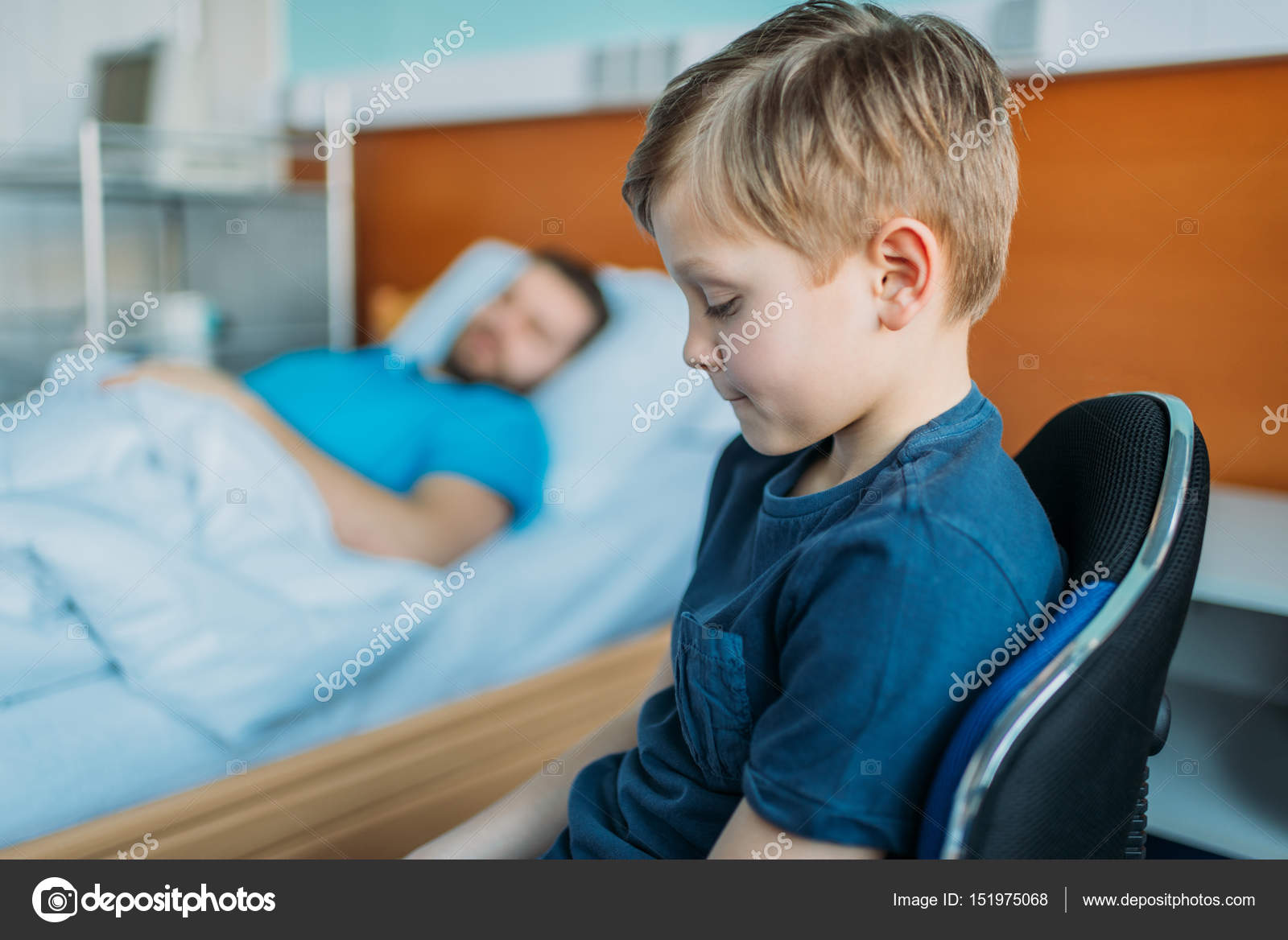 Son sitting near sick father at ward — Stock Photo © AlexLipa