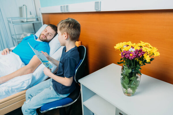 son showing sick father drawings