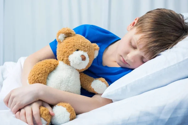 Little boy in hospital bed — Stock Photo, Image