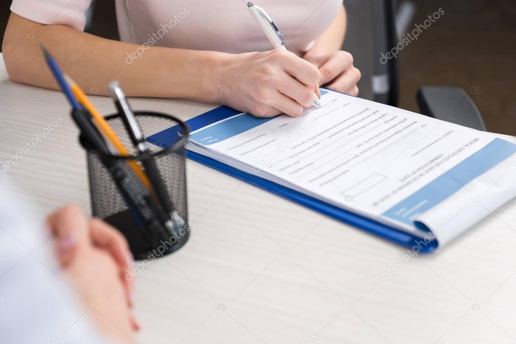 patient filling medical form