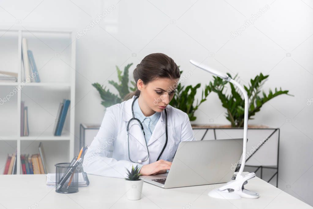 Doctor using laptop 