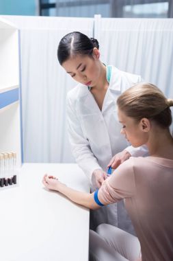 doctor preparing patient to blood test clipart