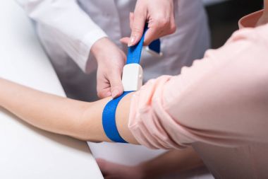 doctor preparing patient to blood test clipart