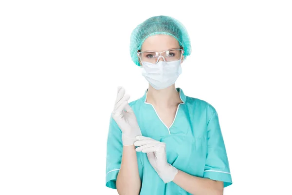 Surgeon putting on medical gloves — Stock Photo, Image