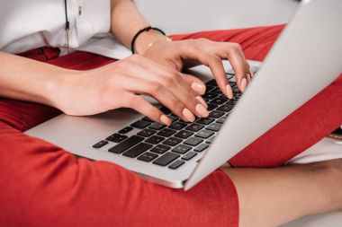 young woman working on laptop clipart