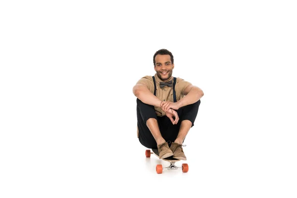 Stylish young man with skateboard — Free Stock Photo