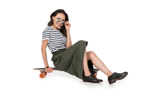 Hipster girl with skateboard — Stock Photo, Image