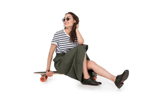 Hipster girl with skateboard — Stock Photo, Image