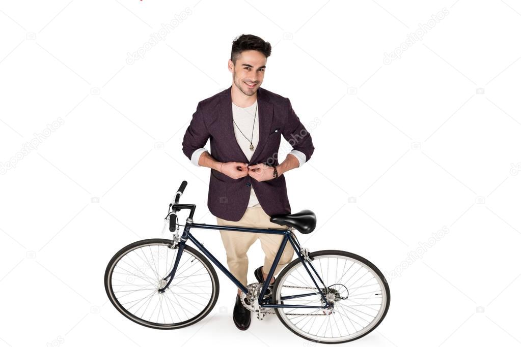 Stylish young man with bicycle 