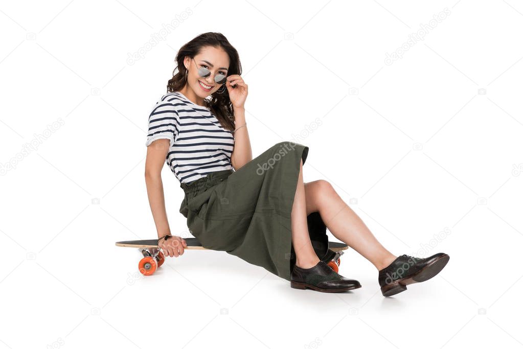 Hipster girl with skateboard 