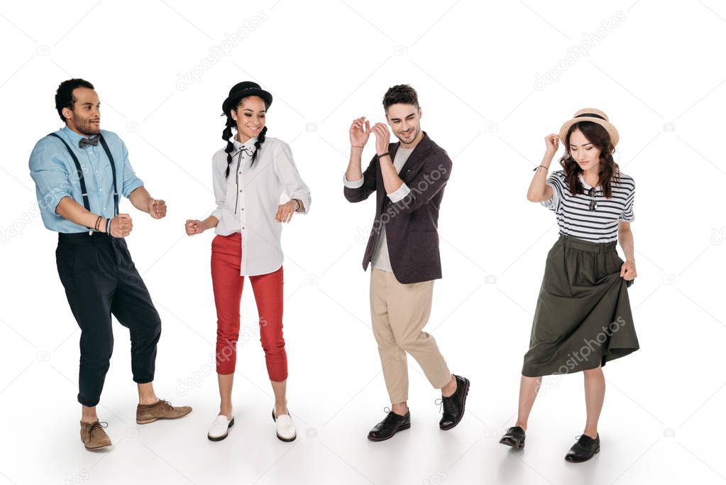 young stylish multiethnic friends dancing