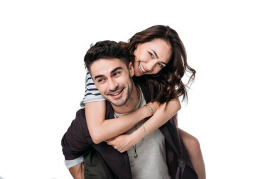 young smiling couple doing piggyback clipart