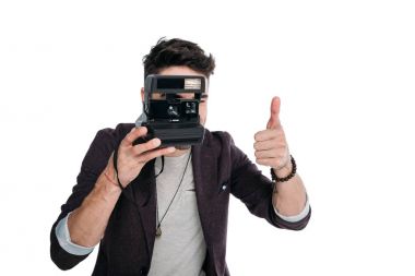 man taking photo with polaroid camera clipart