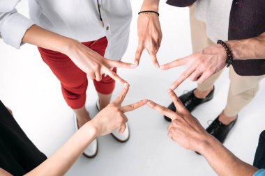 friends gathered hands in form of star clipart