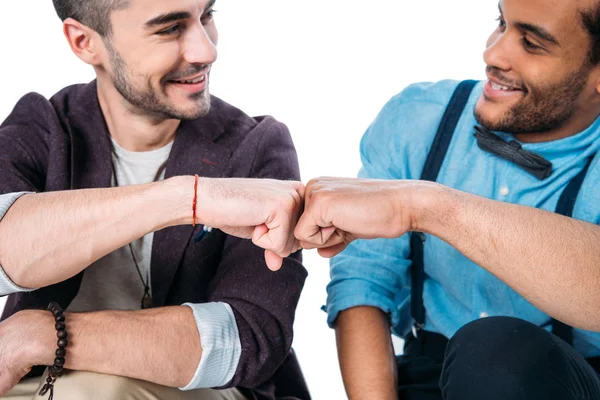 Friends smiling and doing fist bump — Stock Photo, Image