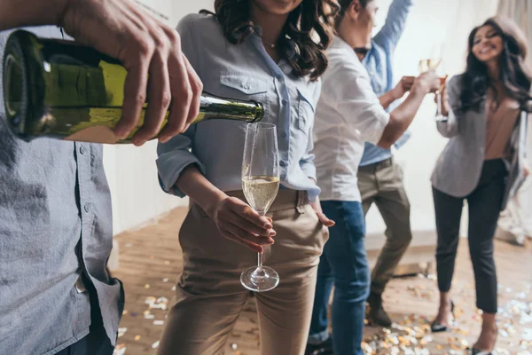 Young people celebrating with champagne — Stock Photo, Image