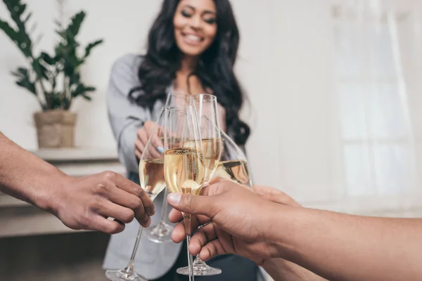 Friends clinking with champagne glasses — Stock Photo, Image