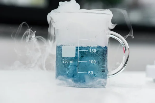 Flask with reagent and steam — Stock Photo, Image