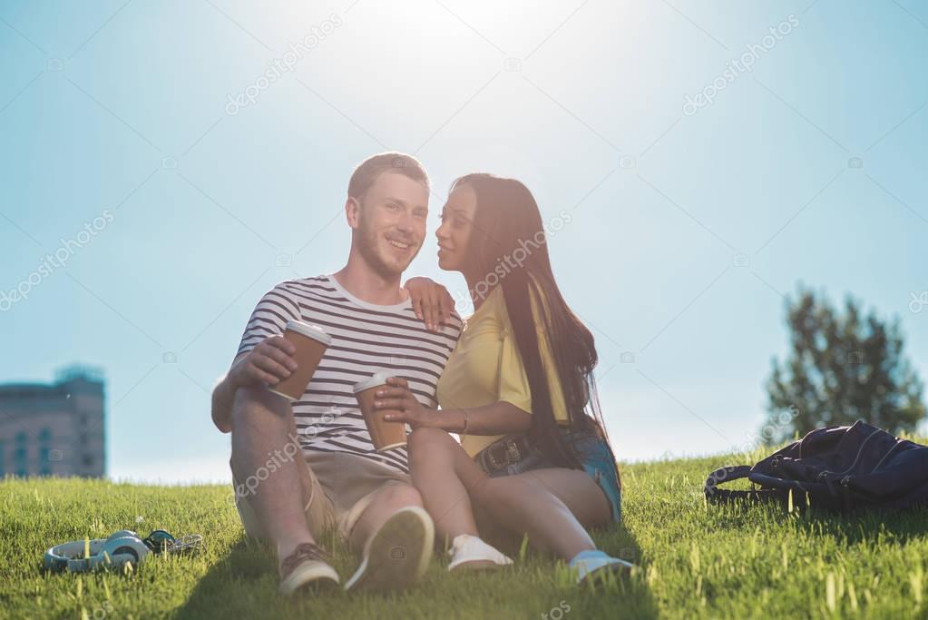 Multiethnic couple with coffee