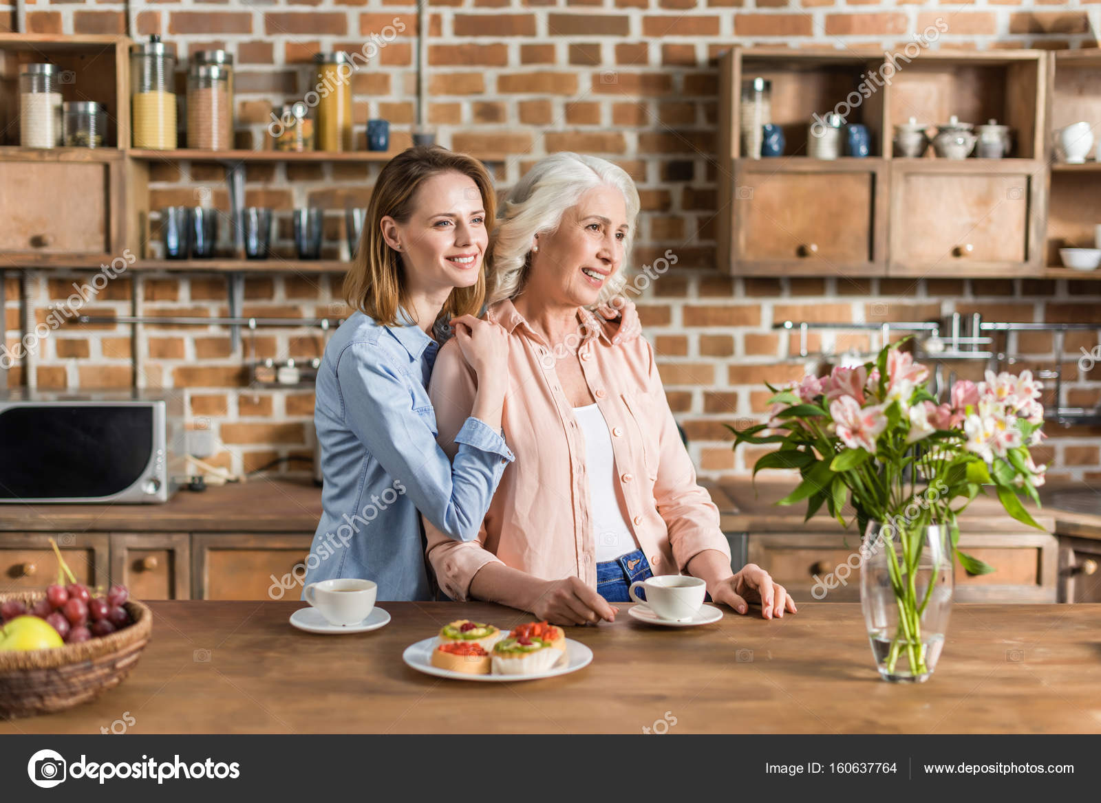 Women having good time in kitchen Stock Photo by ©AlexLipa 160637764