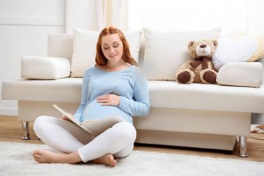 pregnant woman reading book clipart