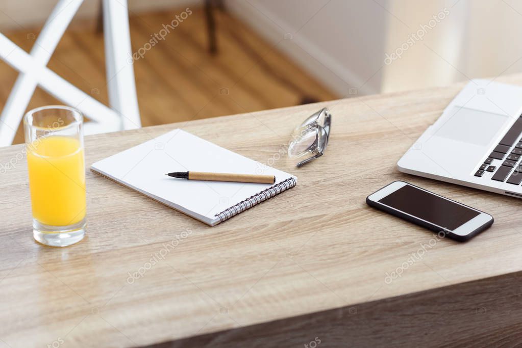notepad, laptop and smartphone 