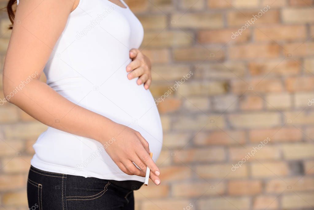 pregnant woman with cigarette