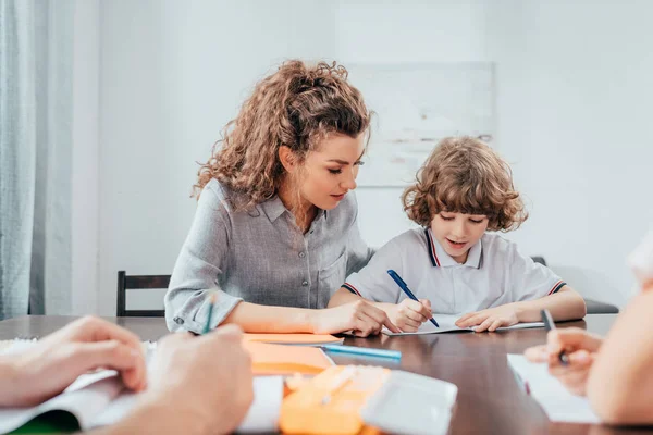 Mother and son doing homework — Stock Photo, Image