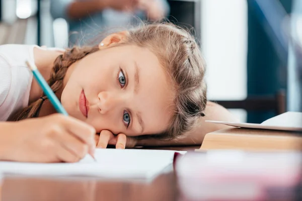 Girl writing homework — Stock Photo, Image