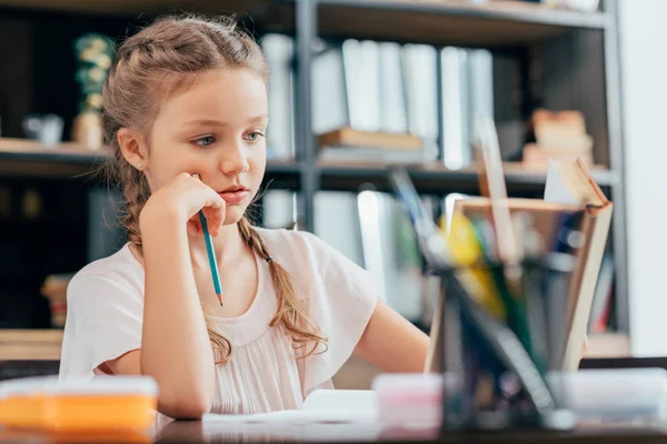 Little girl doing homework — Stock Photo, Image