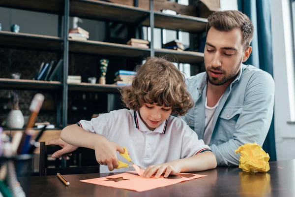 Father and son doing carving — Stock Photo, Image
