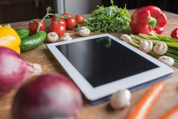 Blank tablet with vegetables — Stock Photo, Image