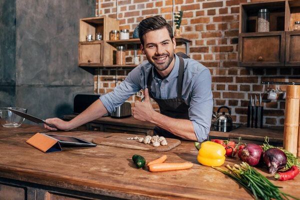 happy young man in kitchen