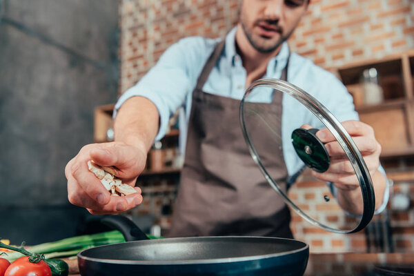 young man cooking