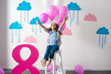 girl with balloons at birthday party clipart