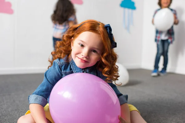 Red haired girl with balloon — Stock Photo, Image