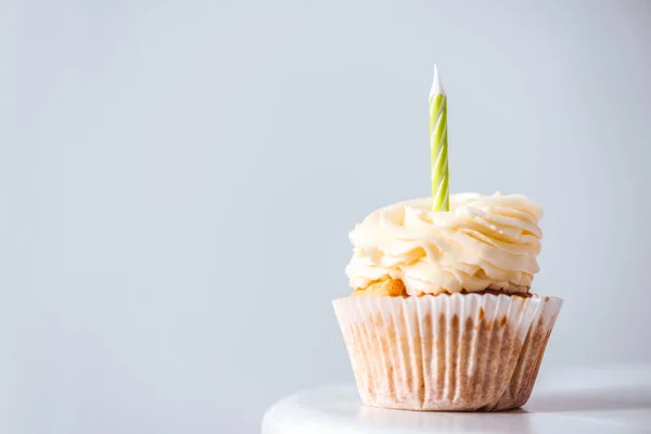 Delicious cupcake with candle — Stock Photo, Image