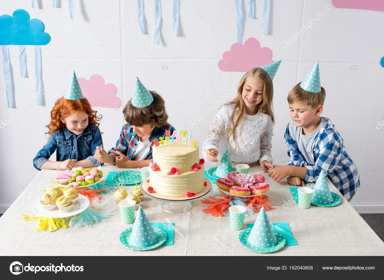 Happy kids at birthday table — Stock Photo © AlexLipa #162040808