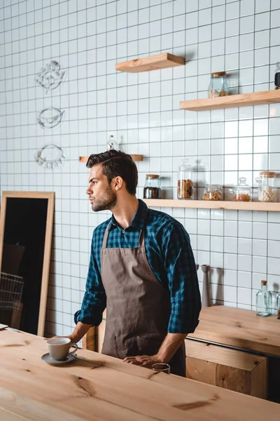 Pensive barista in coffee shop — Stock Photo, Image