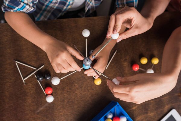 family building atoms model