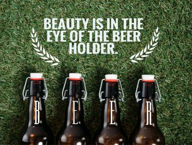 Beer bottles lying on grass clipart