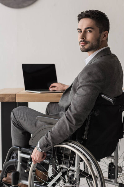 disabled businessman working in office