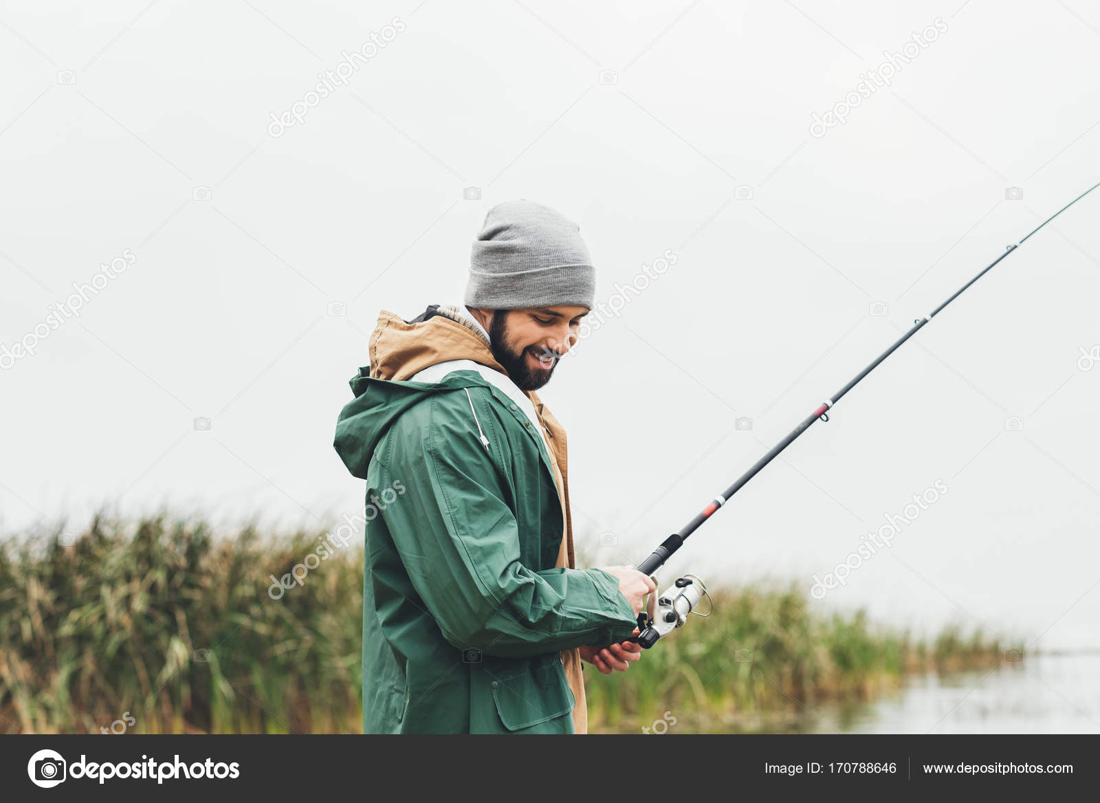 Man fishing on cloudy day — Stock Photo © AlexLipa 170788646