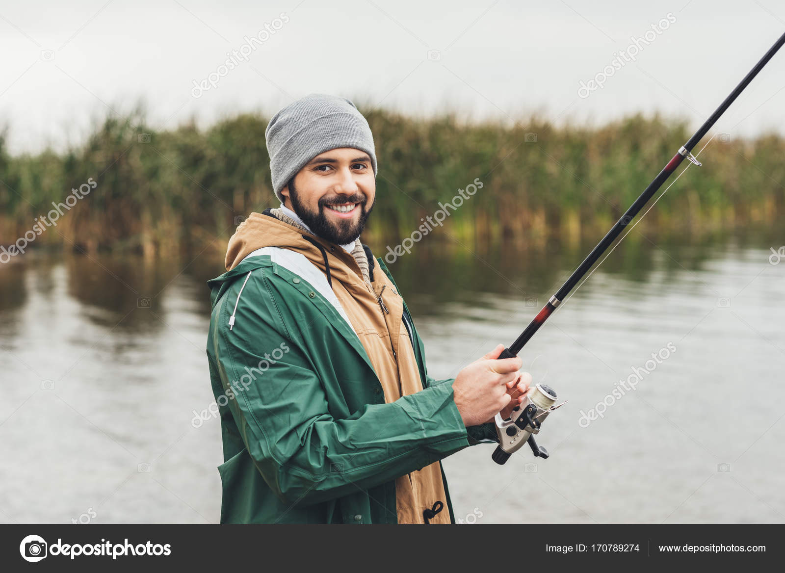 Man fishing on cloudy day — Stock Photo © AlexLipa 170789274