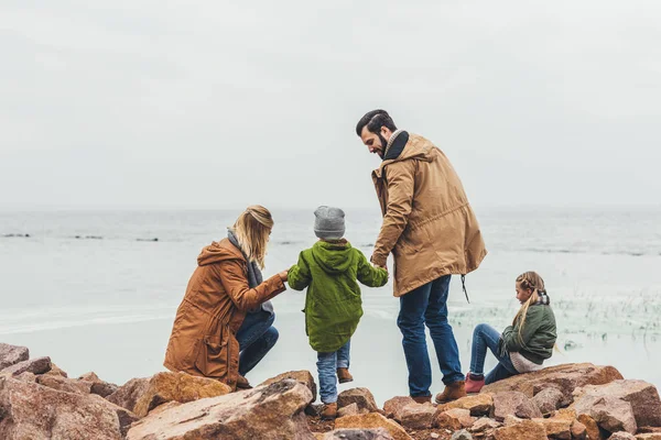 Family spending time on seashore — Stock Photo, Image