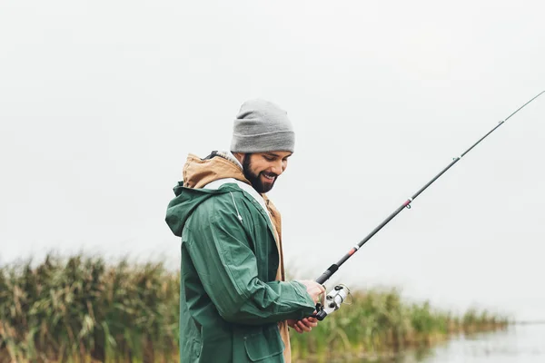 Man fishing on cloudy day — Stock Photo, Image