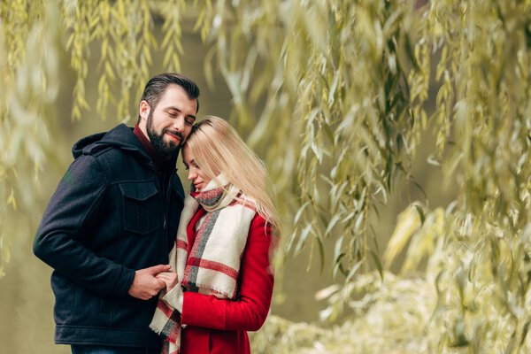 happy couple in autumn park  