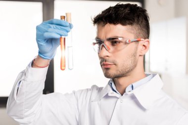 scientist holding test tube clipart