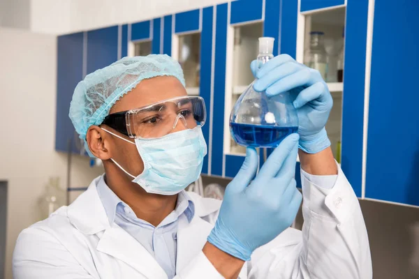 Scientist examining test tube — Stock Photo, Image